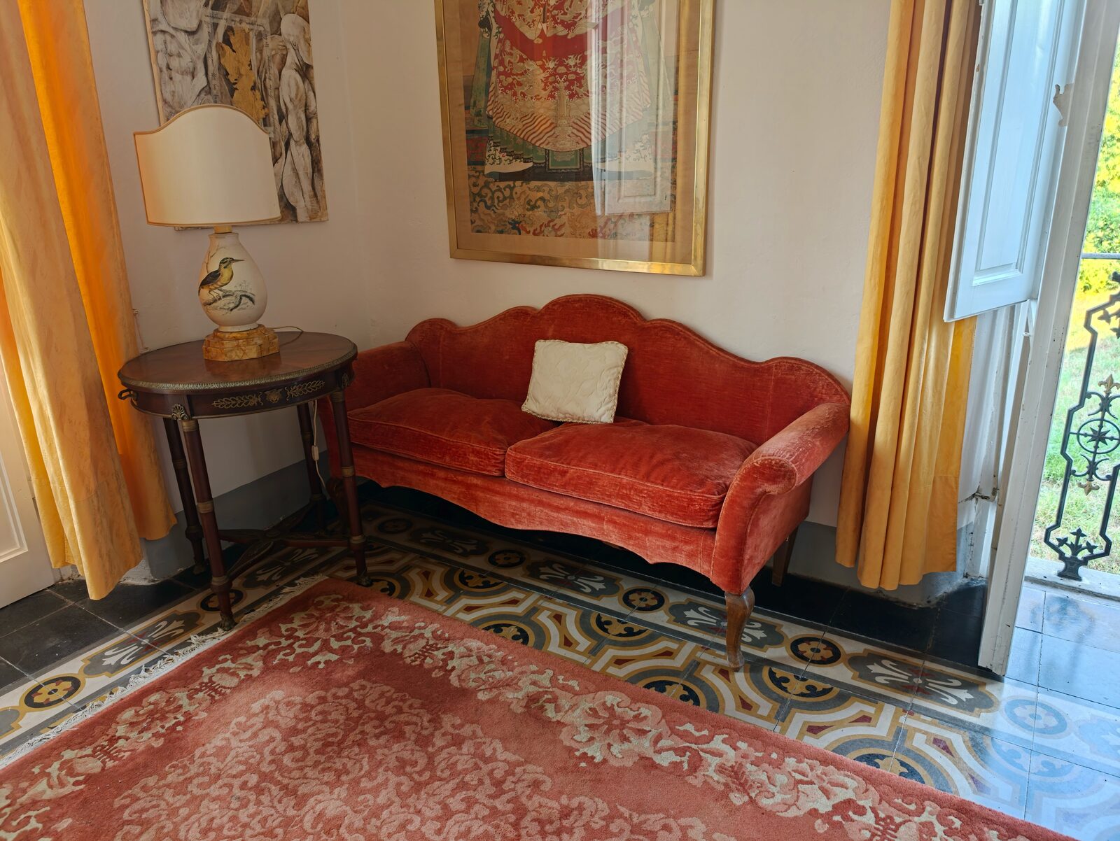 Hallway with velvet sofa in golden light