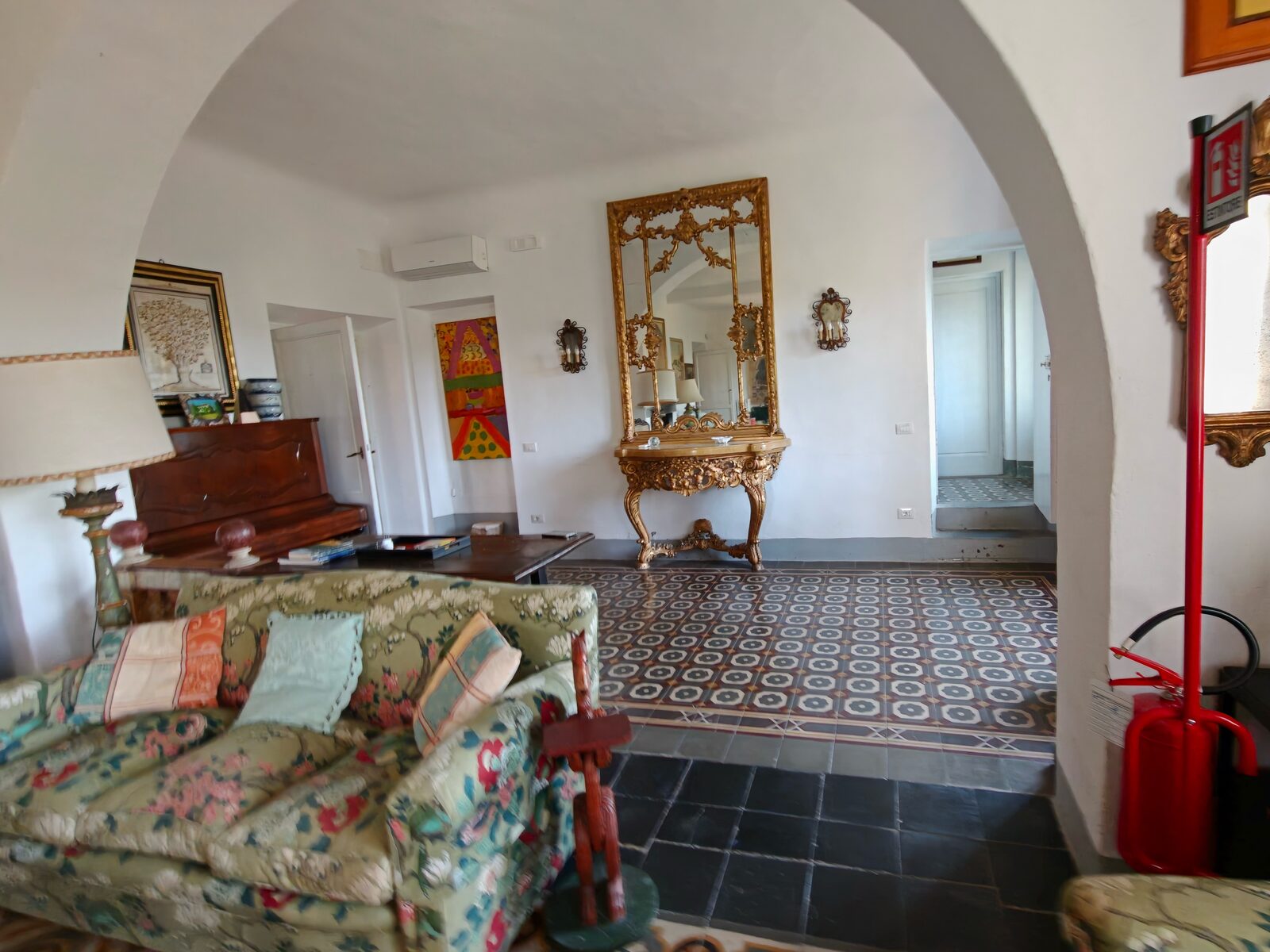 Entrance hallway with ornate mirror
