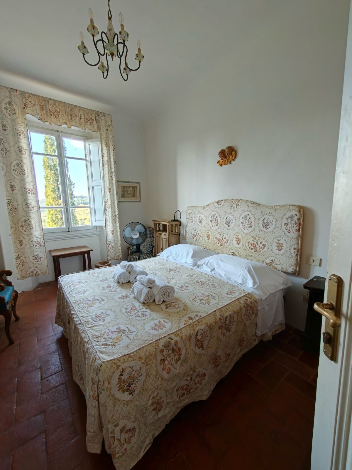 Bedroom with floral bedspread